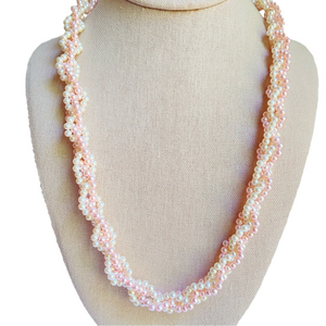 Pink and white mini faux pearl necklace with four intertwined strands 24 inch